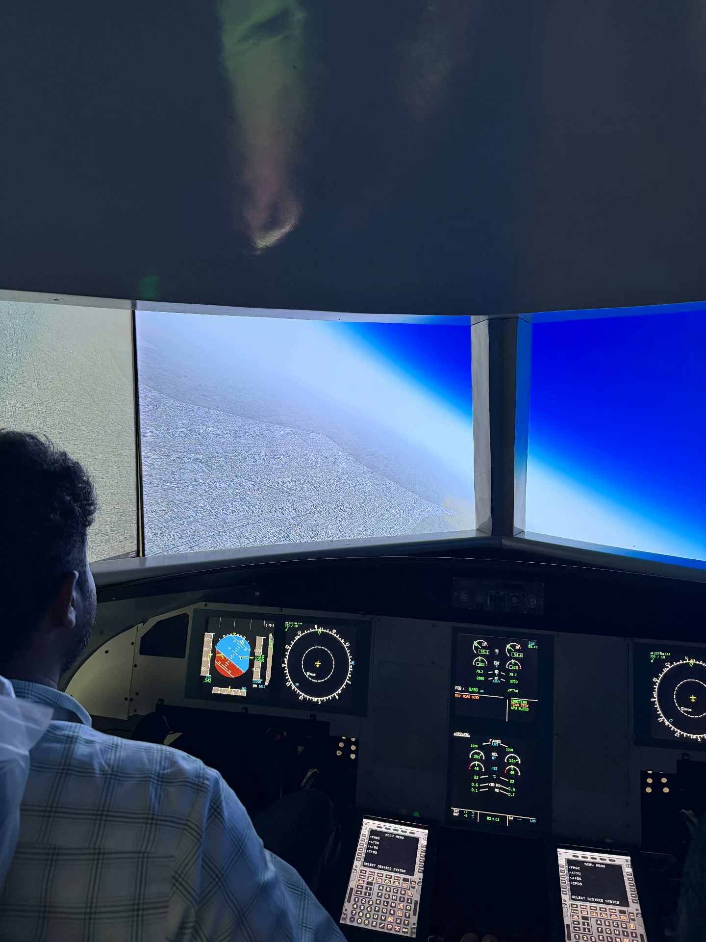 The full A320 instrument panel with navigation and engine displays lit up