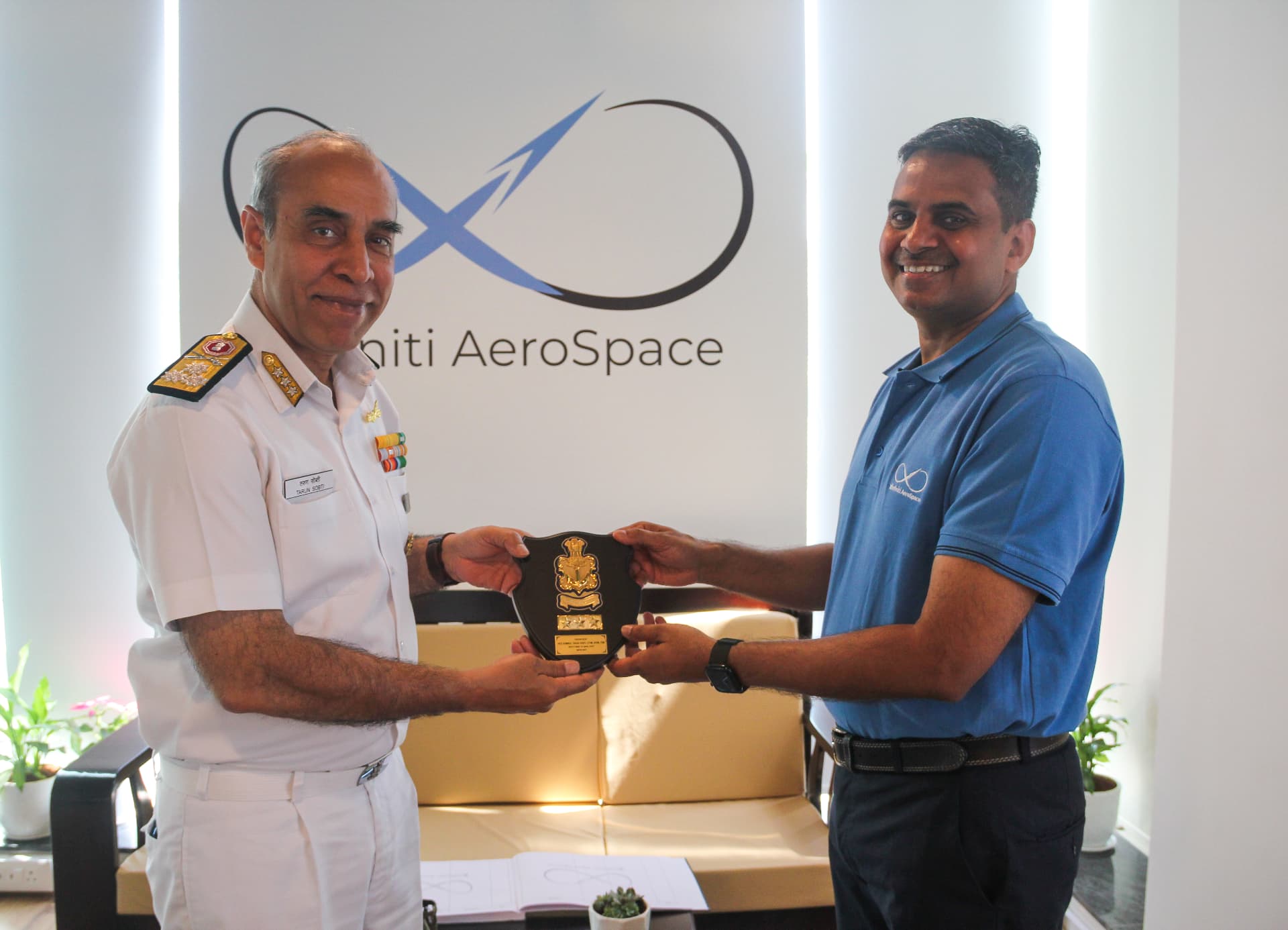 Commodore T.S. Sethi exchanging a memento with Vishal Kumar Verma