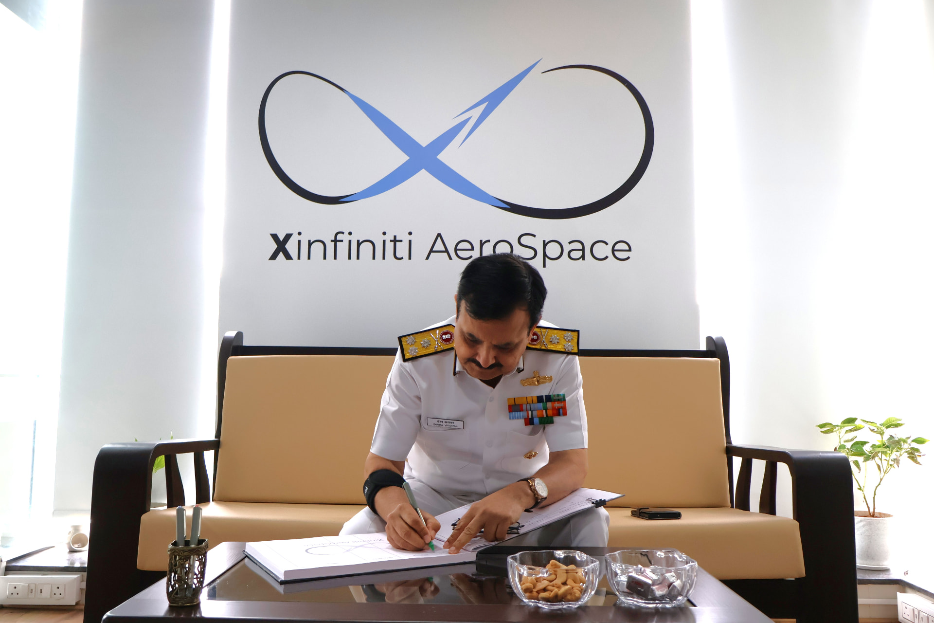 Visitor-book signing during the FOC-in-C (West) visit