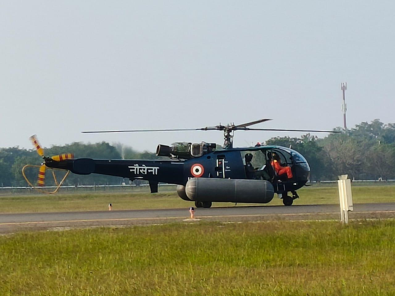 Side view of a naval Chetak helicopter fitted with HEFS emergency floats on the airfield